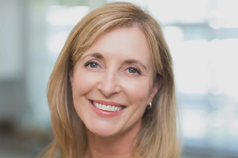 A happy woman smiling at the camera