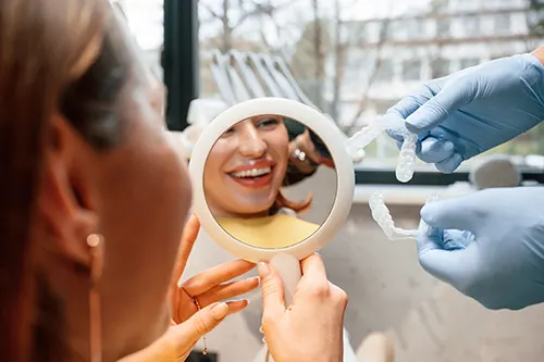 Patient looking at the mirror and smiling.