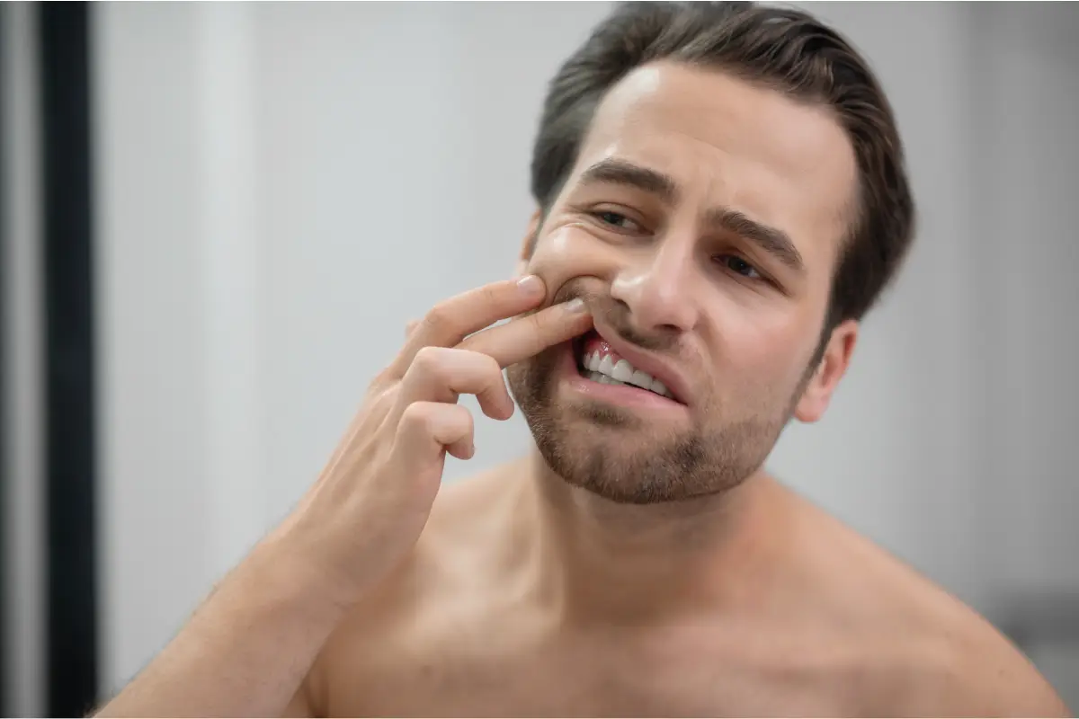 A guy checking his teeth