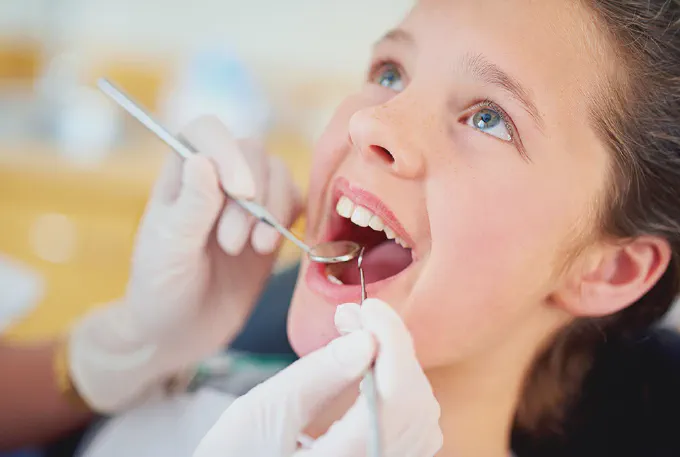 Teen patient getting her teeth cleaned at Premier Dentistry in Gresham Oregon