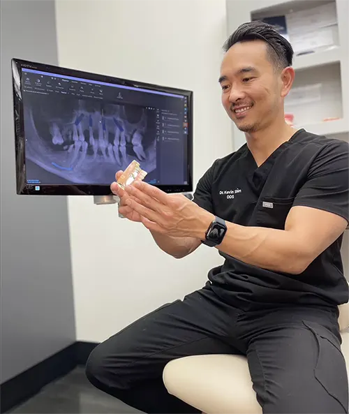 Dr. Kevin Shim holding an impression mold.