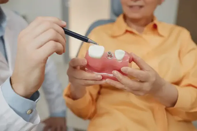 a dentist explaining about dental crowns